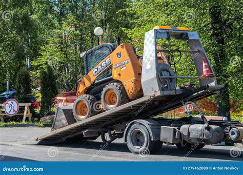 towing with a skid steer|how to tow a skid steer.